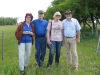 Lilian, Cliff, Emma and Leif posing in front of the gate to the homestead.